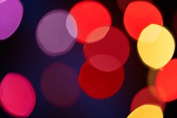 Red and yellow bokeh pattern design element on a dark background