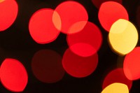 Red and yellow bokeh pattern on a dark background wallpaper