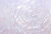 Water ripple design element on a pink holographic background