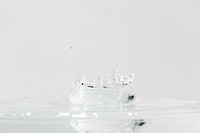 Water splash on top of the glass background wallpaper