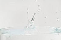 Water splash on top of the glass background wallpaper