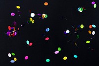 Colorful confetti pattern on a dark background wallpaper
