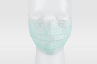 Green disposable surgical face mask on a mannequin