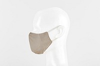 Beige fabric face mask on a dummy head