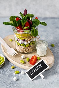 Homemade barley groats salad with goat cheese in a jar