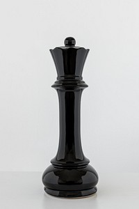 Black queen chess piece on off white background