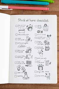 Social isolation doodle style checklist in a notebook