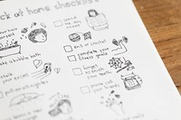 Social isolation doodle style checklist in a notebook