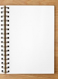 Blank white ruled notebook on a wooden table