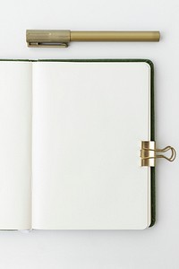 Blank plain white notebook page with stationary