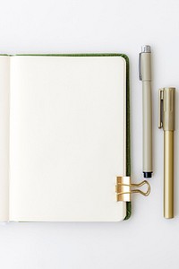 Blank plain white notebook page with stationary