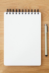 Blank plain white notebook page with a pen