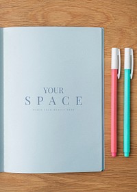 Blank plain blue notebook page with a pen mockup