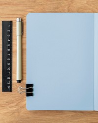 Blank plain notebook page with stationary mockup