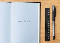 Blank plain blue notebook page with a pen mockup