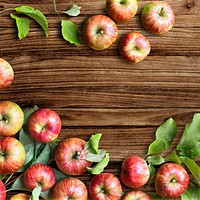 Red apples and leaves psd borders wood background