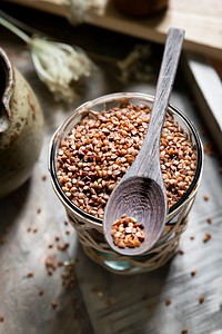 Organic raw buckwheat grain on wooden table