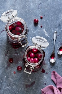 Maraschino cherry in glass jars flat lay food ingredient photography