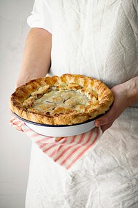 Patisserie holding a cherry pie food photography closeup