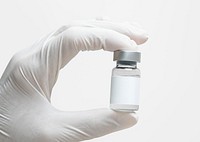 Medicine vial with label mockup psd in doctor's hand