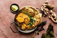 Butter chicken Indian curry in a pan food photography