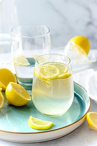 Fresh lemonade soda with sliced lemons in a glass