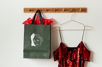 Green feminine bag mockup on a wall hanger 