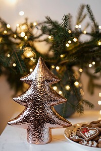 Shiny decorative Christmas tree on the table 
