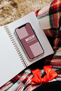 Smartphone mockup screen on a notebook template