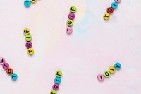 TGIF text alphabet beads pastel watercolor background