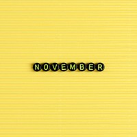 NOVEMBER beads word typography on yellow