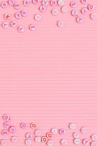 Alphabet beads border pink background