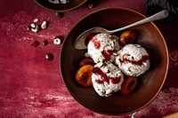 Roasted plums ice cream with chopped hazelnut