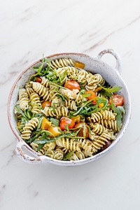 Rotini pasta salad mockup psd with arugula and cherry tomatoes, healthy summer dish