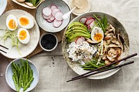 Egg and prawn served with tahini sauce in flat lay photography style