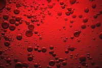 Red background oil bubble in water