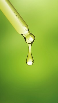 Green phone wallpaper, dropper bottle with yellow solution background