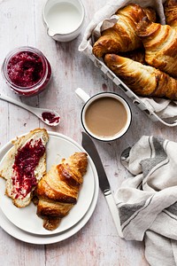 Breakfast set flat lay with croissant and raspberry jam food photography