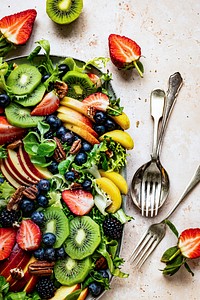 Healthy fruit salad with vegetables and pecans