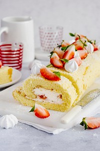 Dessert and tea with strawberry Swiss roll food photography