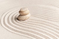 Stacked zen marble stones sand background in mindfulness concept