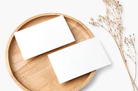 Blank paper on wooden plate in flat lay style