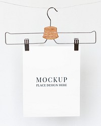 Papers mockup psd hanging from a cloth hanger 