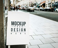Mockup poster on the outside of a shop