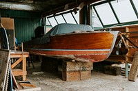 Old wooden boat in a garage