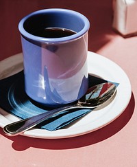 Coffee in a blue cup on a sunny day