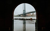 View of the Manhattan bridge from an arch door, USA