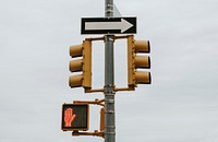 Pedestrian traffic lights in a cloudy day