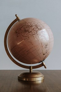 Pink globe sphere in a room