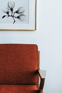 Red couch by a white wall